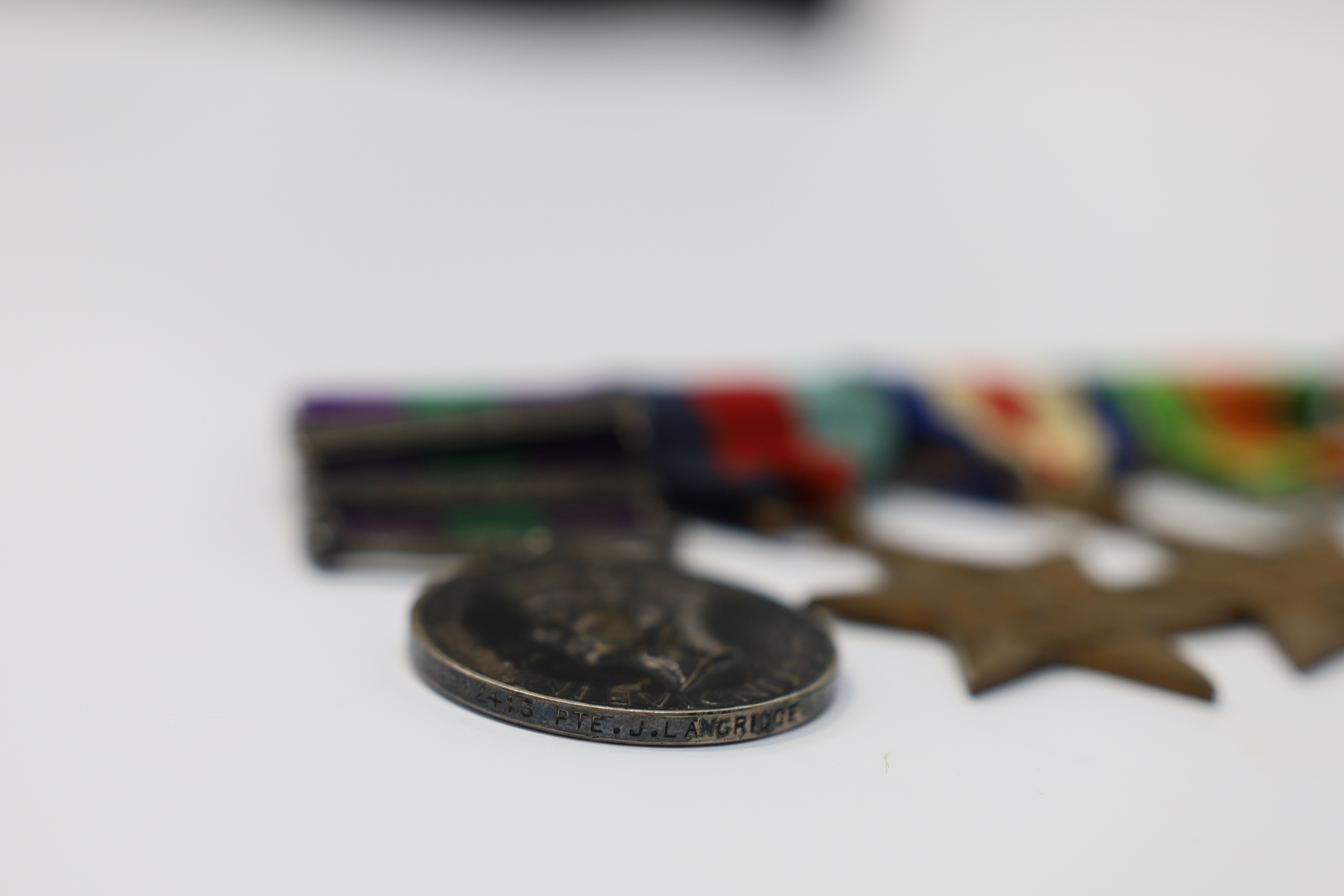 A WWII medal group awarded to Pte. J. Langridge S. Staff, comprising; a General Service Medal with two bars for Palestine and Palestine 1945-48, stamped to the edge with the recipient’s details, together with a 1939-45 S